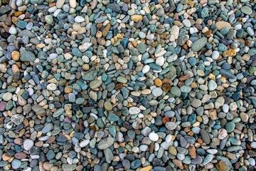Texture of multi-colored stones on the black sea coast