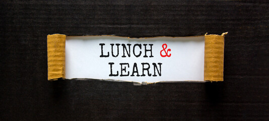 Lunch and learn symbol. Words 'Lunch and learn' appearing behind torn black paper. Beautiful black...