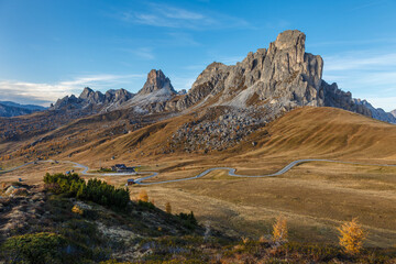 Fantastic autumn landscape,alpine pass and yellow pine trees,Passo Giau with famous Ra...