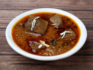 Patodi Rassa Bhaji or patwadi Sabji, a popular Maharashtrian spicy recipe served with Chapati and salad. Selective focus