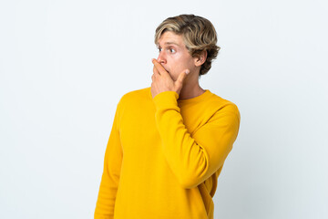 English man over isolated white background doing surprise gesture while looking to the side