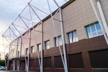 Obraz premium Facade of the building, stadium in the evening with cine lighting.