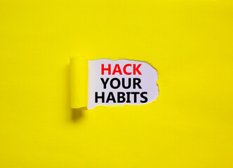Hack your habits symbol. Words 'Hack your habits' appearing behind torn yellow paper. Beautiful yellow background. Business, psychology and hack your habits concept, copy space.