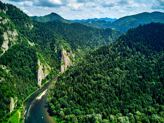 Beautiful aerial panoramic view of the Pieniny National Park, Poland in sunny day. Sokolica and Trzy Korony - English: Three Crowns (the summit of the Three Crowns Massif) and Dunajec river © udmurd
