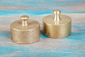 Fototapeta na wymiar Two antique bronze weights for scales.