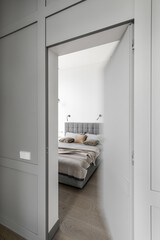 Fototapeta na wymiar Modern Minimalism Style Bedroom Interior In Beige and grey Tones
