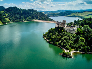 Beautiful aerial panoramic view of Niedzica Castle also known as Dunajec Castle and Lake Czorsztyn (Polish: Jezioro Czorsztynskie) is a man-made reservoir on the Dunajec river, southern Poland © udmurd