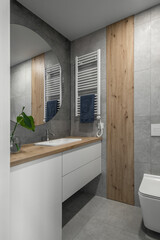 Modern minimalist bathroom interior design with grey stone tiles and wood wall texture