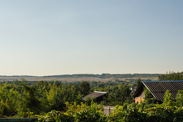 View of old roofs and gardens of outskirts of provincial town