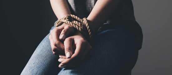 young woman's hands are tied
