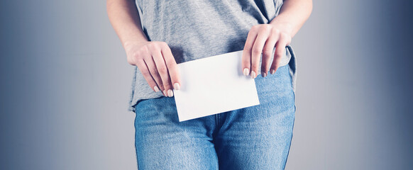 young woman holding blank paper