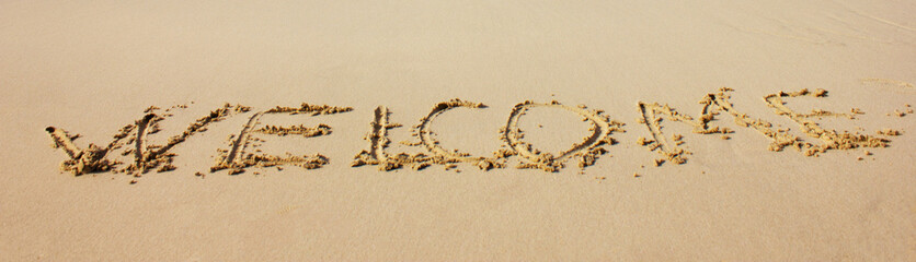 beach sand lettering welcome