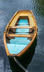 Fototapeta na wymiar Wooden boat in combination natural color and blue color