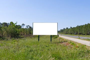 Outdoor billboard banners in fields on summer day mockup. Empty billboard blank for advertising in green field.