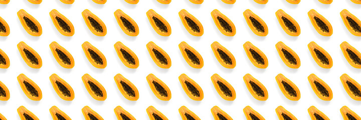 Fresh ripe papaya background on white backdrop. Modern tropical abstract background. Top view. Creative design, minimal flat lay concept. Trend tropical fruit food background - not seamless pattern