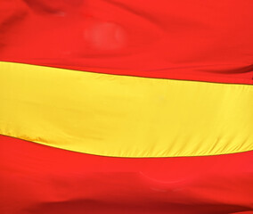 Flag of Spain, called La Rojigualda, waving.