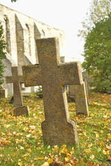 Stone crosses in the old cemetery in autumn