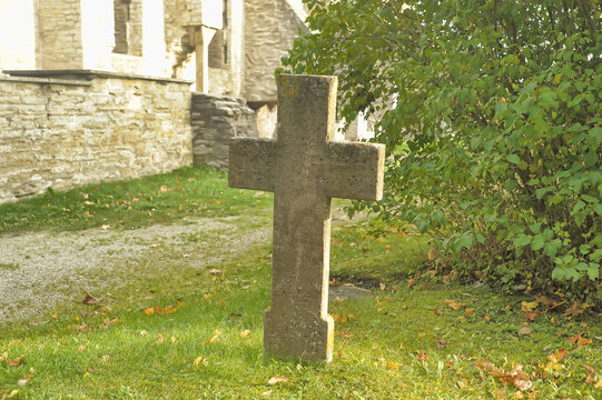 Stone crosses in the old cemetery in autumn