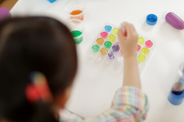 young  girl  play science experiments for homeschooling