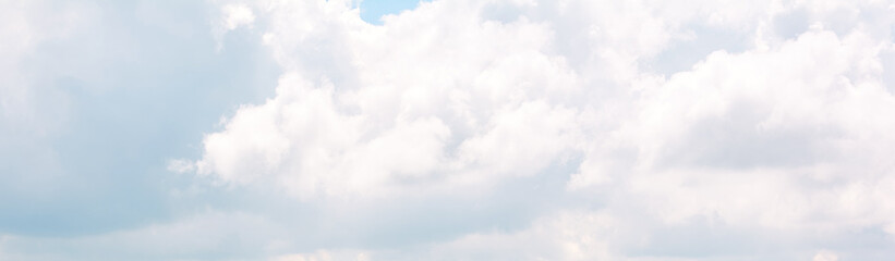 Beautiful blue sky and white clouds of various shapes with sunlight. Nature background