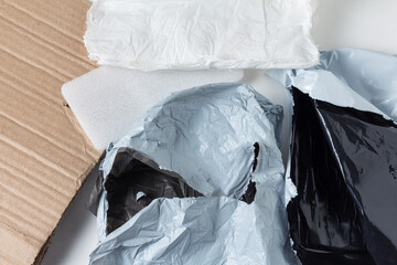 Opened plastic mail bags, cardboard and plastic packaging after unpacking the goods. Mail trash
