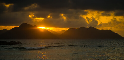 Naklejka premium Sunset on Praslin Island in the Seychelles from the island of La Digue