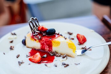 Cheesecake with peaches, raspberry mousse with pieces of fruit. Delicious dessert.