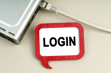 There is a router connected to the network on the table, next to a sign that says - Login