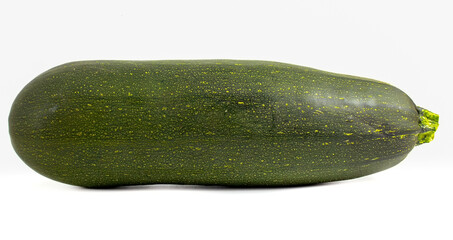 Green zucchini isolated on white background. Fresh vegetables close up.