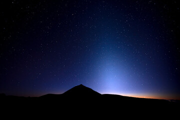 Landscape of zodiacal light and the Milky Way on blue night - obrazy, fototapety, plakaty