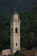 Fototapeta na wymiar old bell tower with clock of a Catholic church