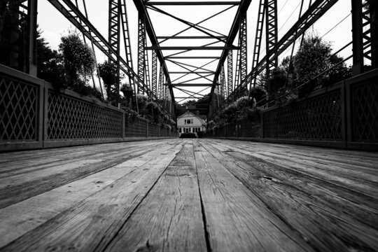 Drake Hill Flower Bridge Simsbury Connecticut.  Black and white photo of iron bridge with wooden planks.