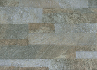 Textura de superfície construída com várias pedras diferentes de cores cinzentas, beges, sépias - rugosidades