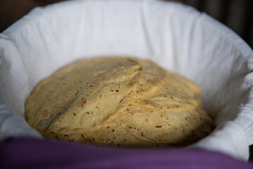 Corn tortillas in a basket with a tablecloth to cover them