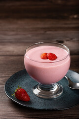 Delicious strawberry mousse in glass goblet.