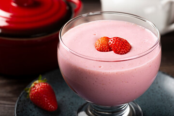 Delicious strawberry mousse in glass goblet.