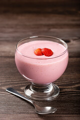 Delicious strawberry mousse in glass goblet.