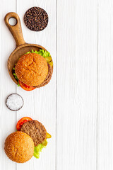 Sandwiches hamburger with chicken burger and green salad. Overhead view