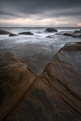shapes in the rocks on the ocean