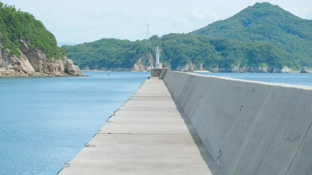 Beautiful Landscape of Seawall or Breakwater in The Blue Sea or Ocean in The Afternoon in Summer, Summer Vacation or Travel Background, Ogijima Island in Kagawa Prefecture in Japan, Nobody