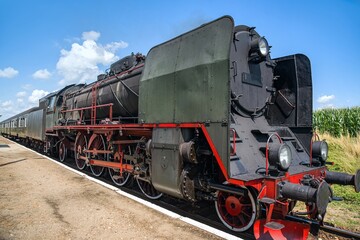 Fototapeta na wymiar Old locomotive on the rural railway 