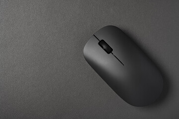 top view black wireless mouse on a dark background