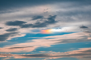 Fototapeta premium Rainbow cloud in the sky during sunset