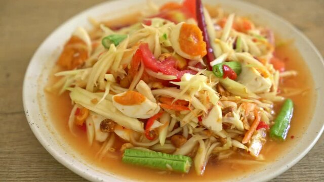 Som Tum - Thai Spicy green papaya salad with salty eggs - Asian food style
