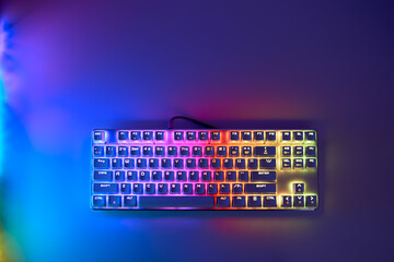 Mechanical gaming keyboard with backlight, top view. Gaming keyboard with RGB backlight. RGB LED...