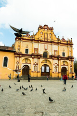 cultural and traditional center of san cristobal in chiapas mexico with flying pigeons