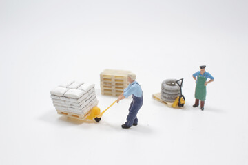a Miniature people: Worker transportation the goods