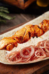Grilled georgian chicken breast shashlik skewers with onion
