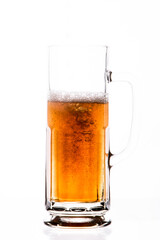 amber beer being served in jar on white background