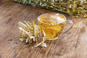 A cup of lime tea with honey. Dried linden flowers are used in folk medicine, honeydew flower